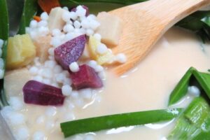 sweet potatoes and taro with sago in coconut milk in a pot