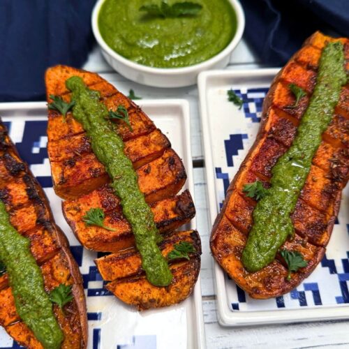 air fryer sweet potato with mint tahini on a blue white plate