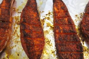 slightly charred edges of sweet potato halves