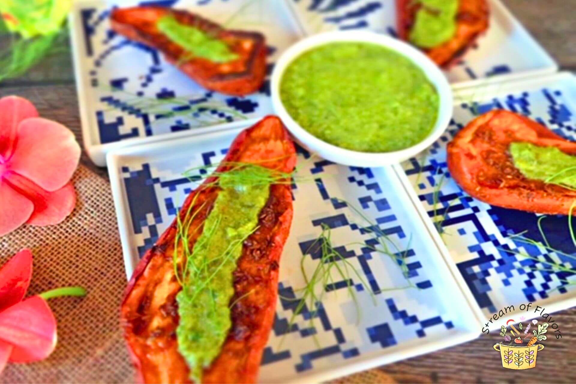 sweet potato with tahini dressing on white and blue plate