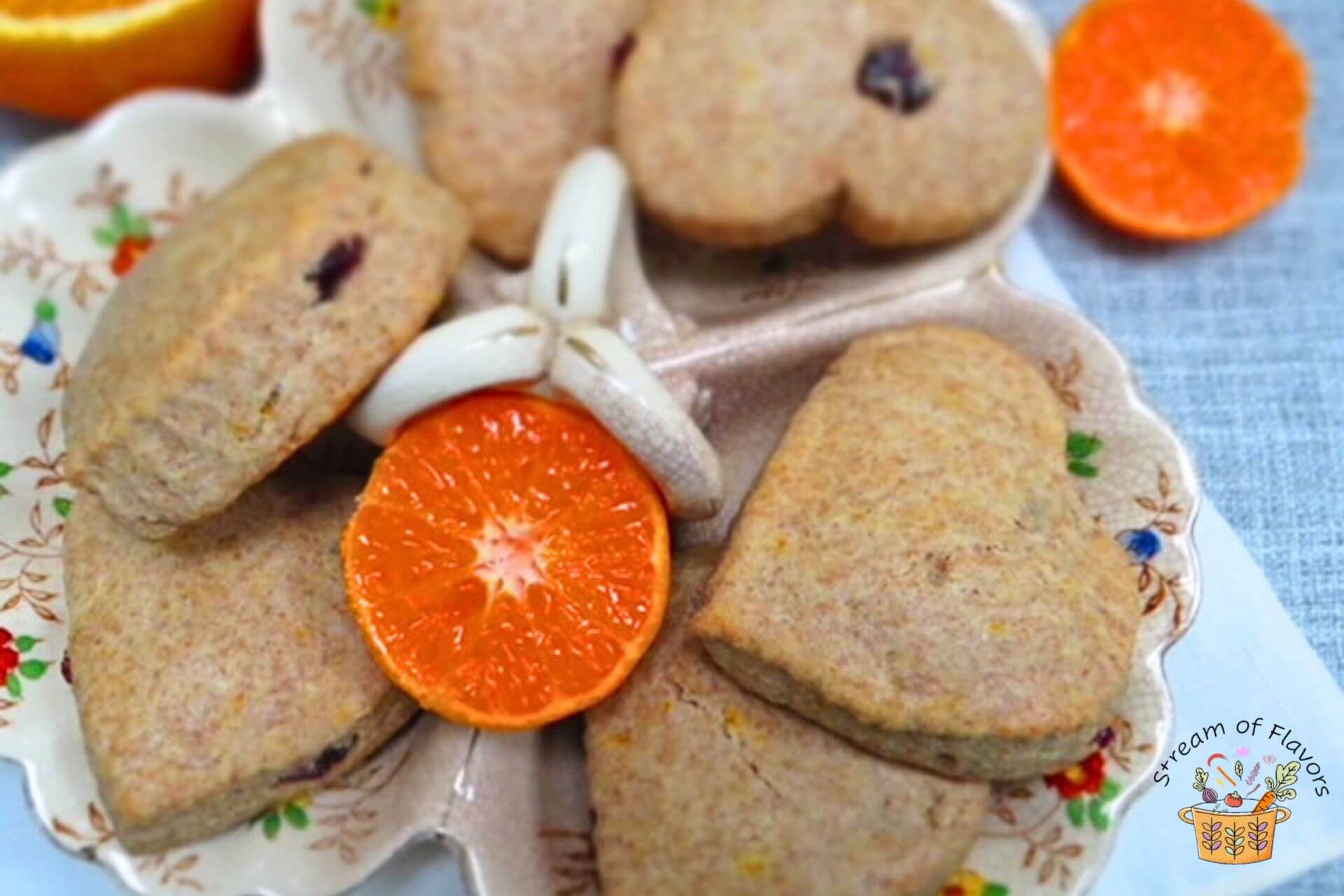 easy orange scones recipe in a bowl with a cut orange