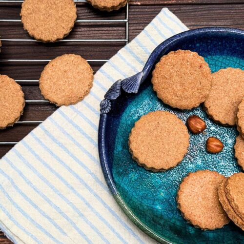 ground hazelnut cookies on a blue plate