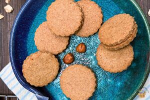 ground hazelnut cookies in a blue plate