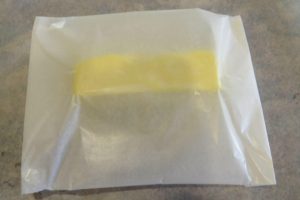 place the butter in wax paper
