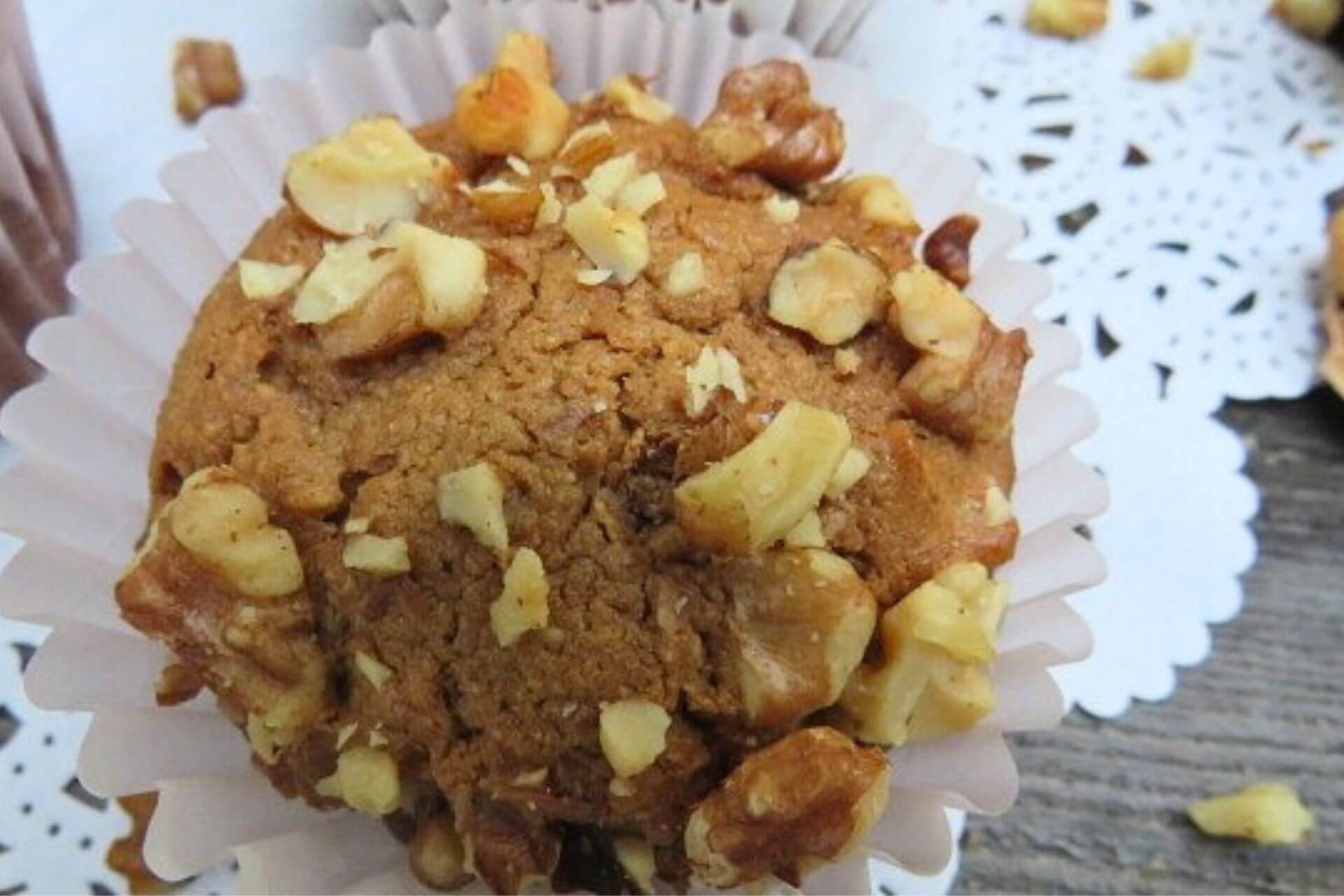 a single apple muffin in a baking cup