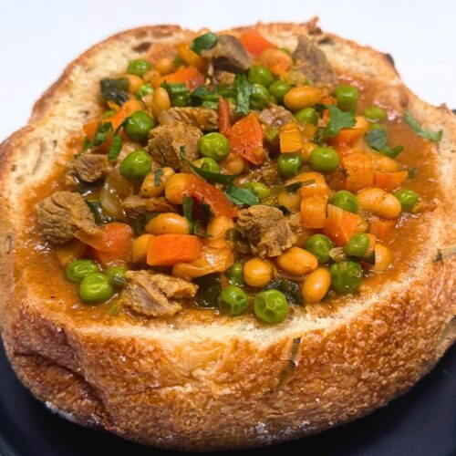 indian lamb stew in a bread boule