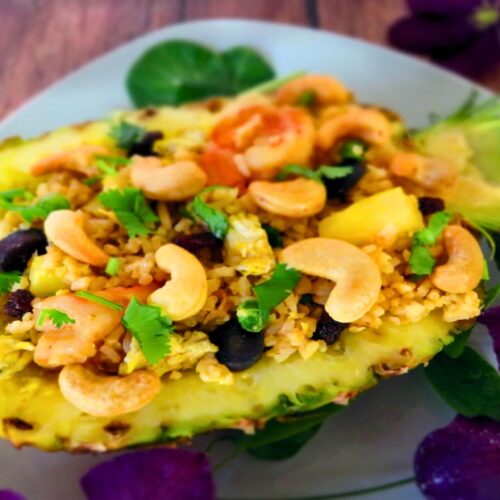 pineapple fried rice recipe in a pineapple shell with cashews