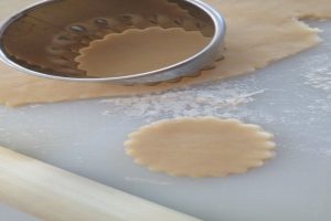 Use a cutter and stamp out the tart shells