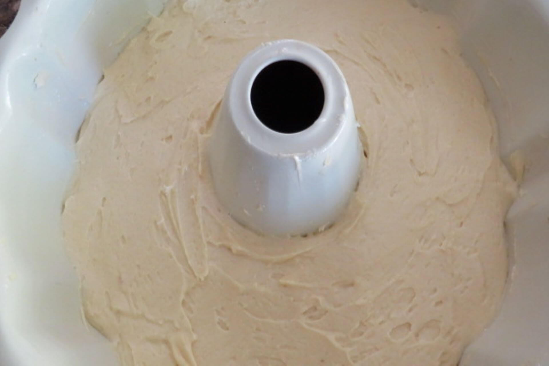 cake batter smoothened on top in a ring mold