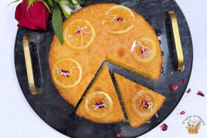 greek semolina cake with lemon slices and dried rose petals