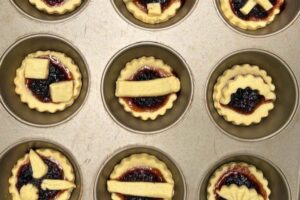 raspberry jam tarts baked in a muffin tray