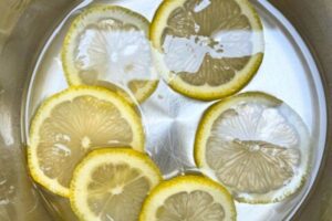 lemon slices in sugar syrup in a pot