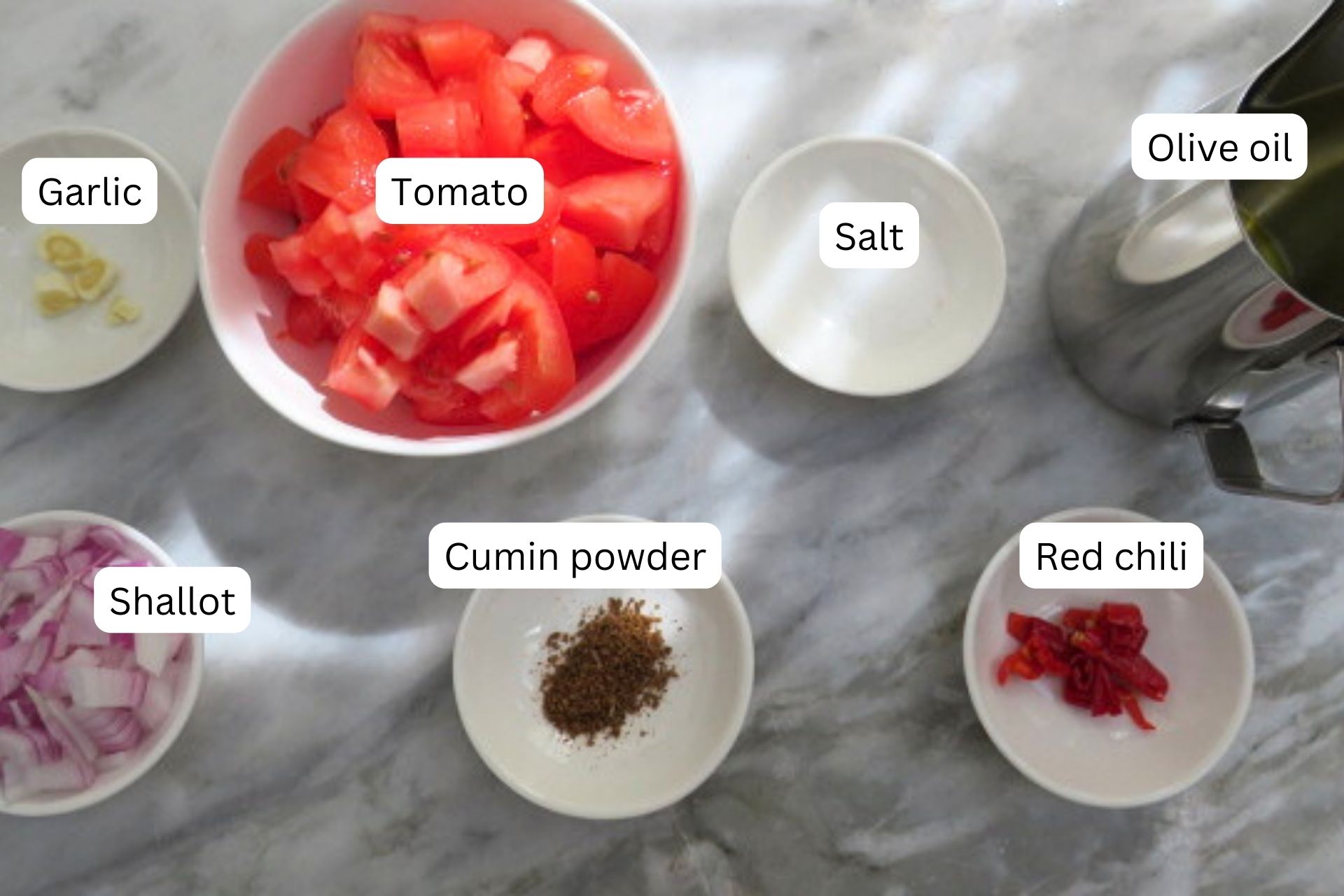 ingredients in bowls for the taco sauce