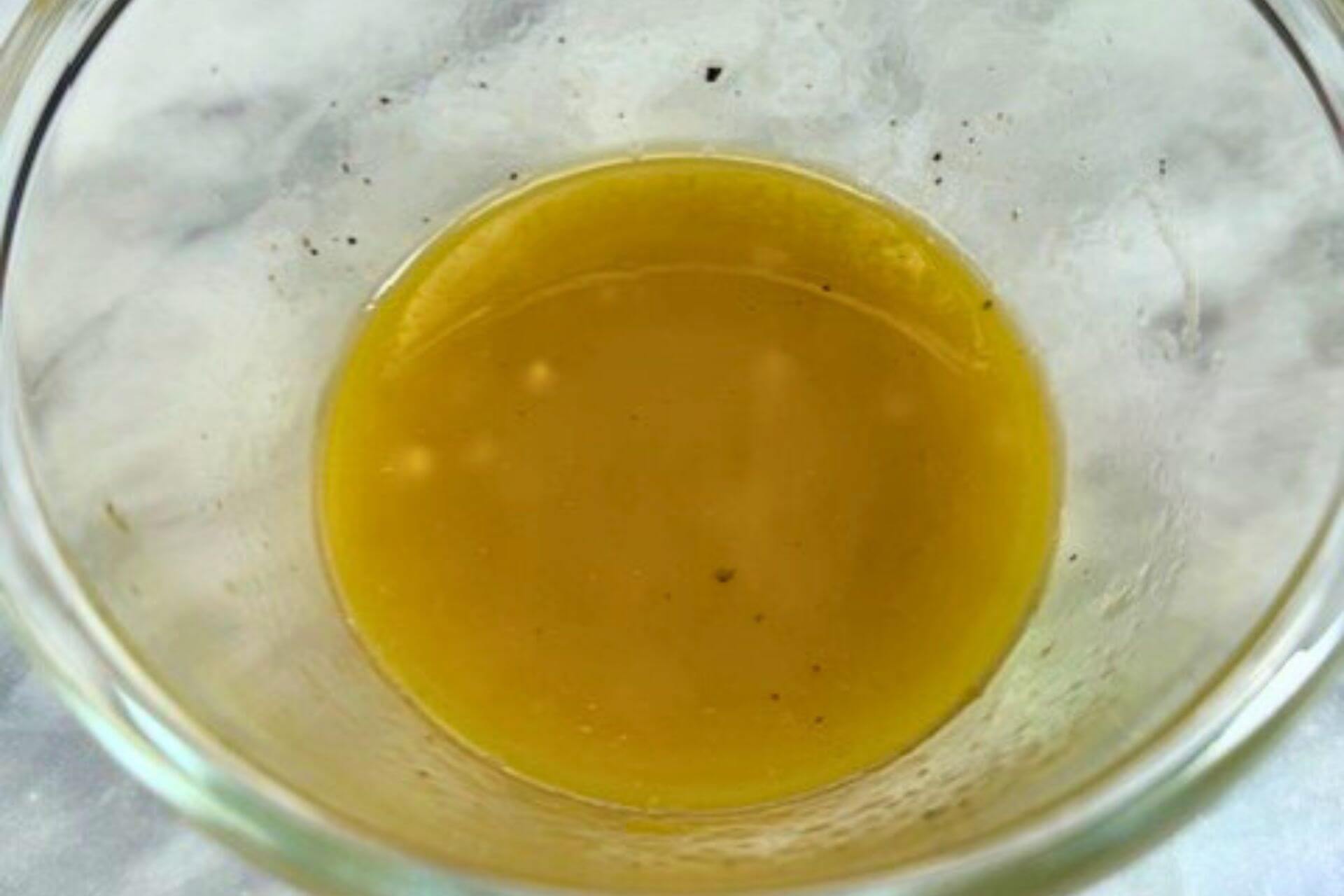 orange vinaigrette in a mixing bowl