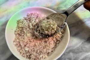 balls rolled on the freshly grated and steamed coconut