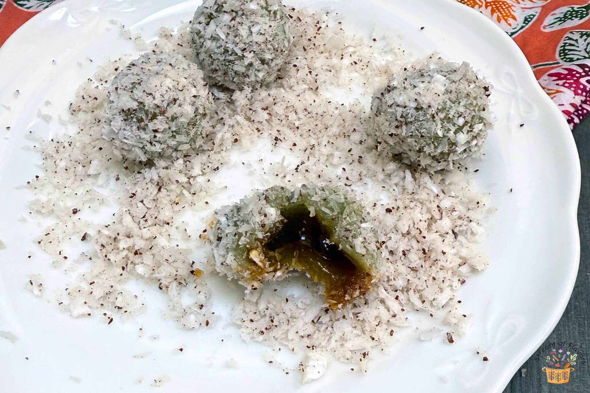 ondeh ondeh ball cut open open with the melted gula Melaka inside