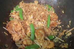 break up the eggs and add the sauces for the Pad Thai with Shrimp