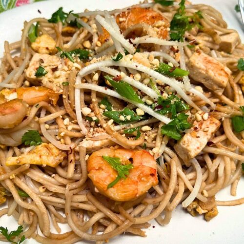 shrimp pad thai recipe on a white plate