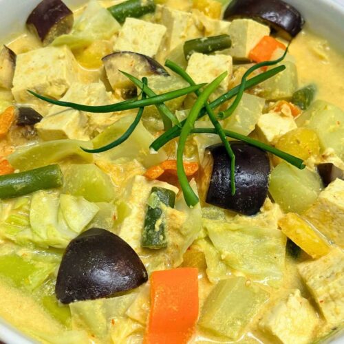 sayur lodeh in a white bowl