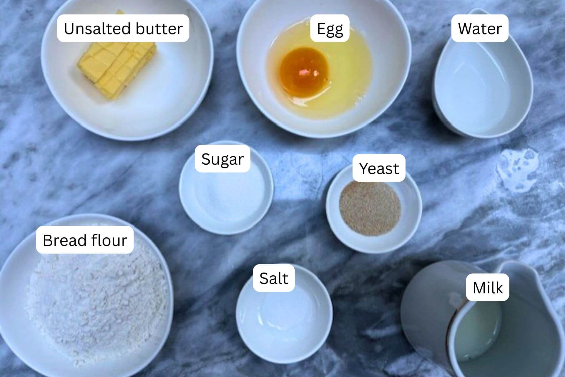 measured ingredients in bowls for the sweet brioche recipe