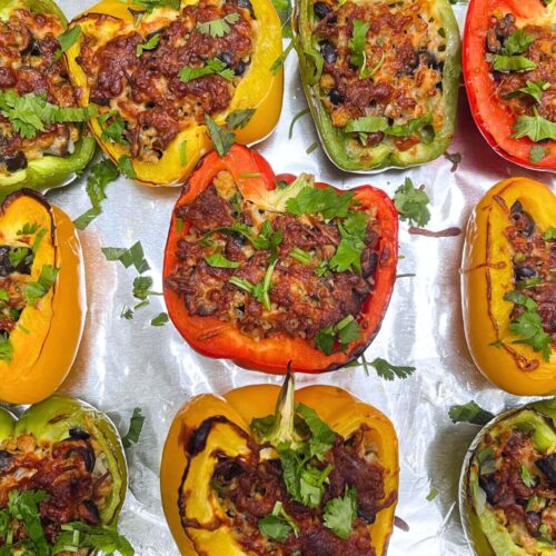 ground chicken stuffed peppers with cheese in a tray