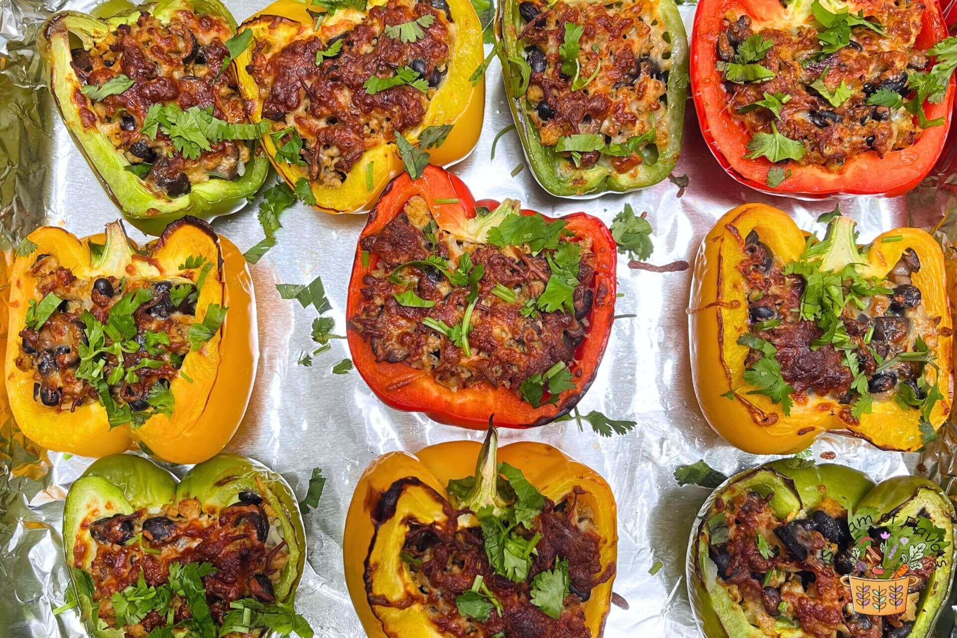 ground chicken stuffed peppers with cheese in a tray