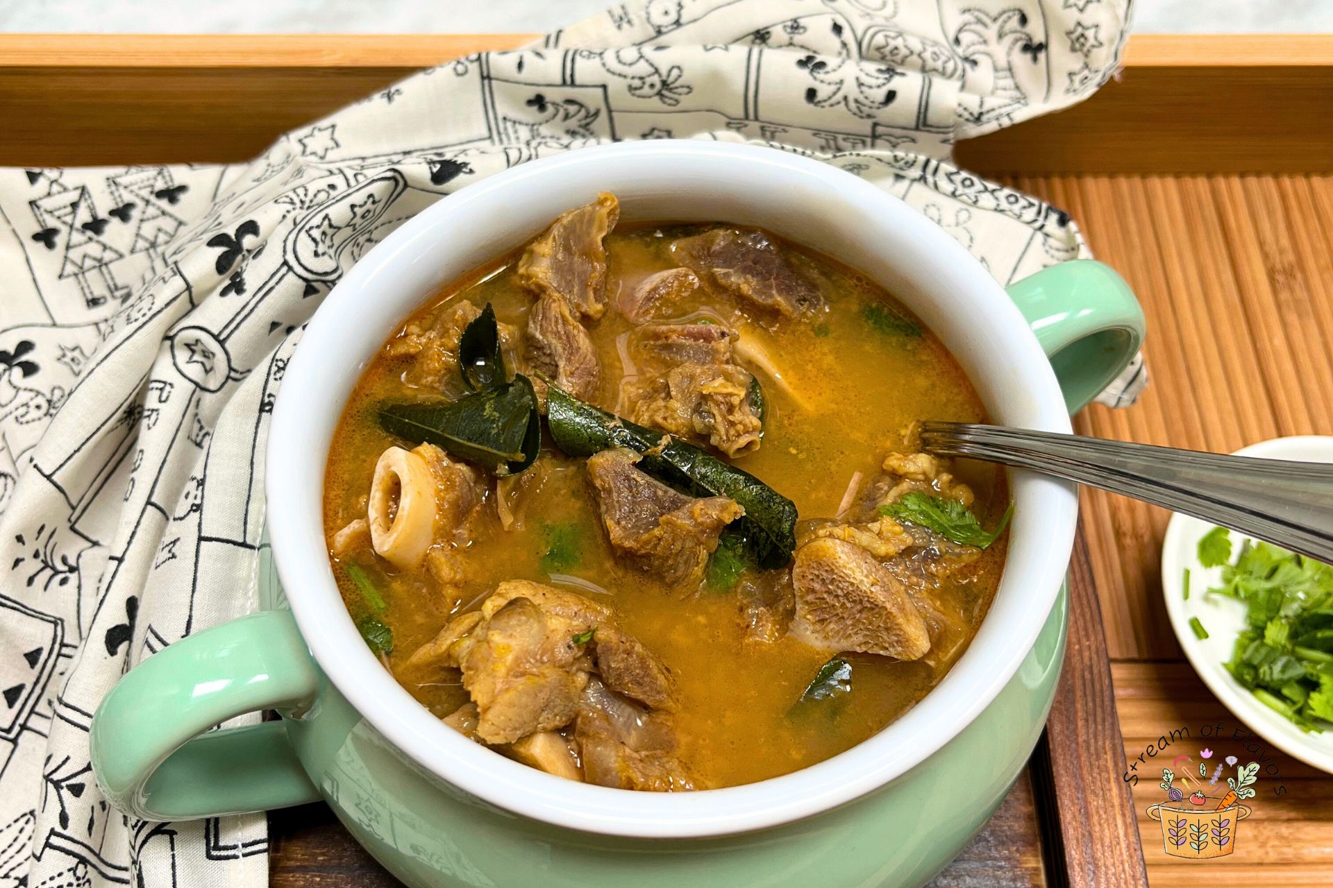 mutton bone soup in a green bowl