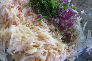 mix grated potatoes and onions