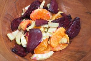 beets, fennel and orange in a wooden bowl