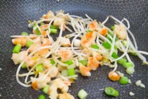 shrimp and bean sprouts in a wok