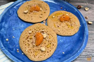moroccan semolina pancakes on a blue plate