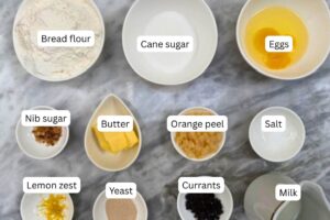 measured ingredients in bowls for the Bath buns recipe