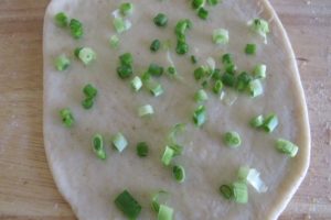 top the pancake with green onion