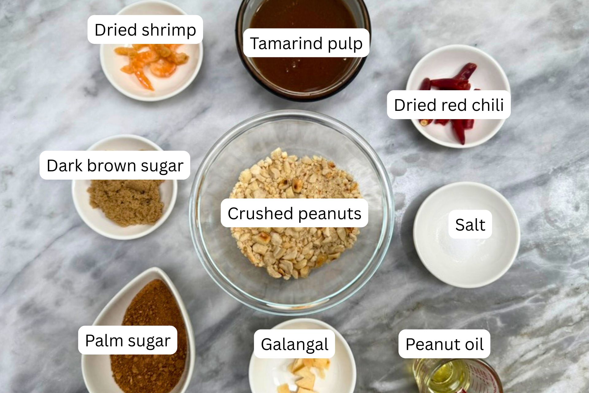 measured ingredients for the rujak recipe's peanut sauce in bowls