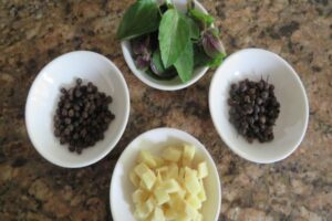 tulsi ginger and peppercorns in bowls