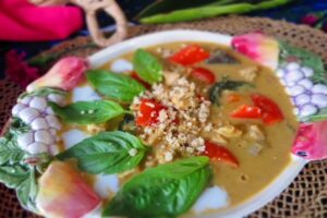 garnish the panang chicken curry with basil