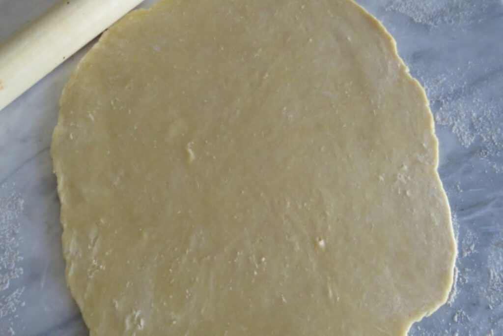 rolled short crust in a large round
