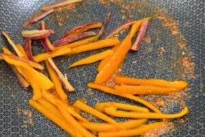 pepper and carrot stir fried with chili garlic sauce