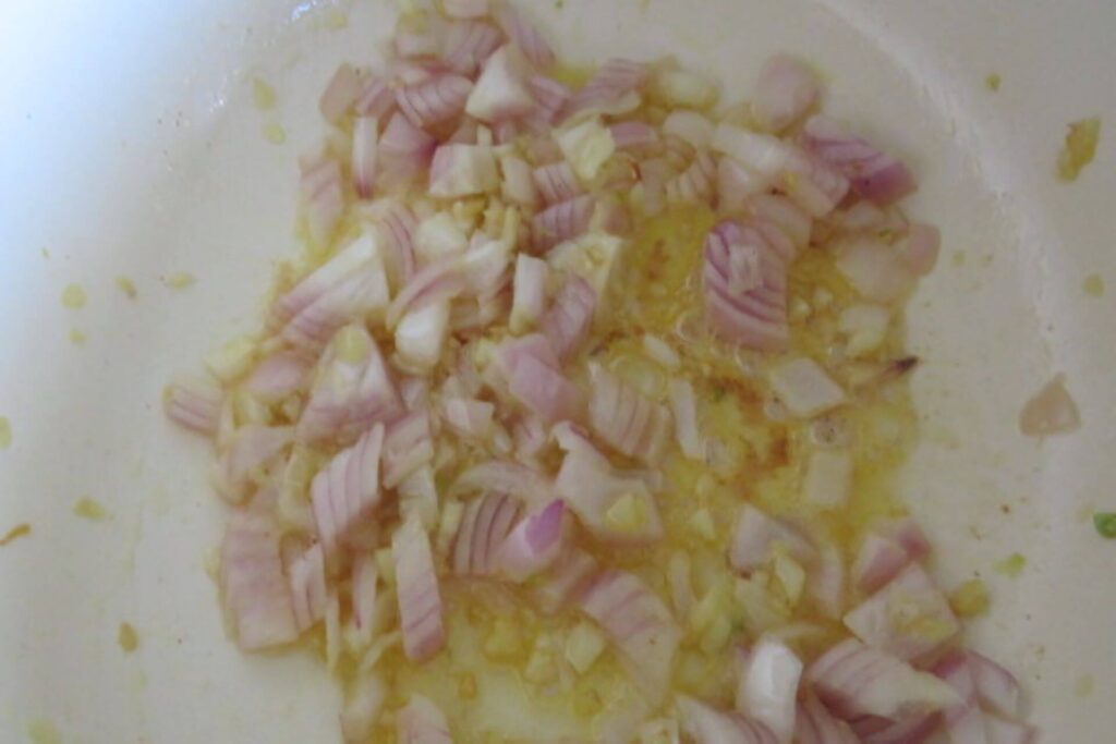 onions sauteed in a pan with garlic