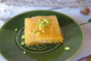 Lebanese baklawa on a plate with pistachios