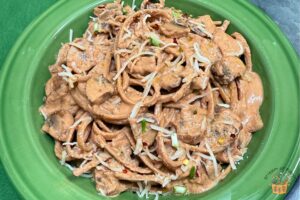 linguine with mushrooms recipe with grated Parmesan cheese in a green pasta bowl