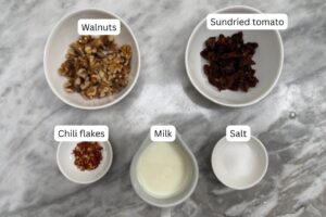 measured ingredients in bowls for the paste