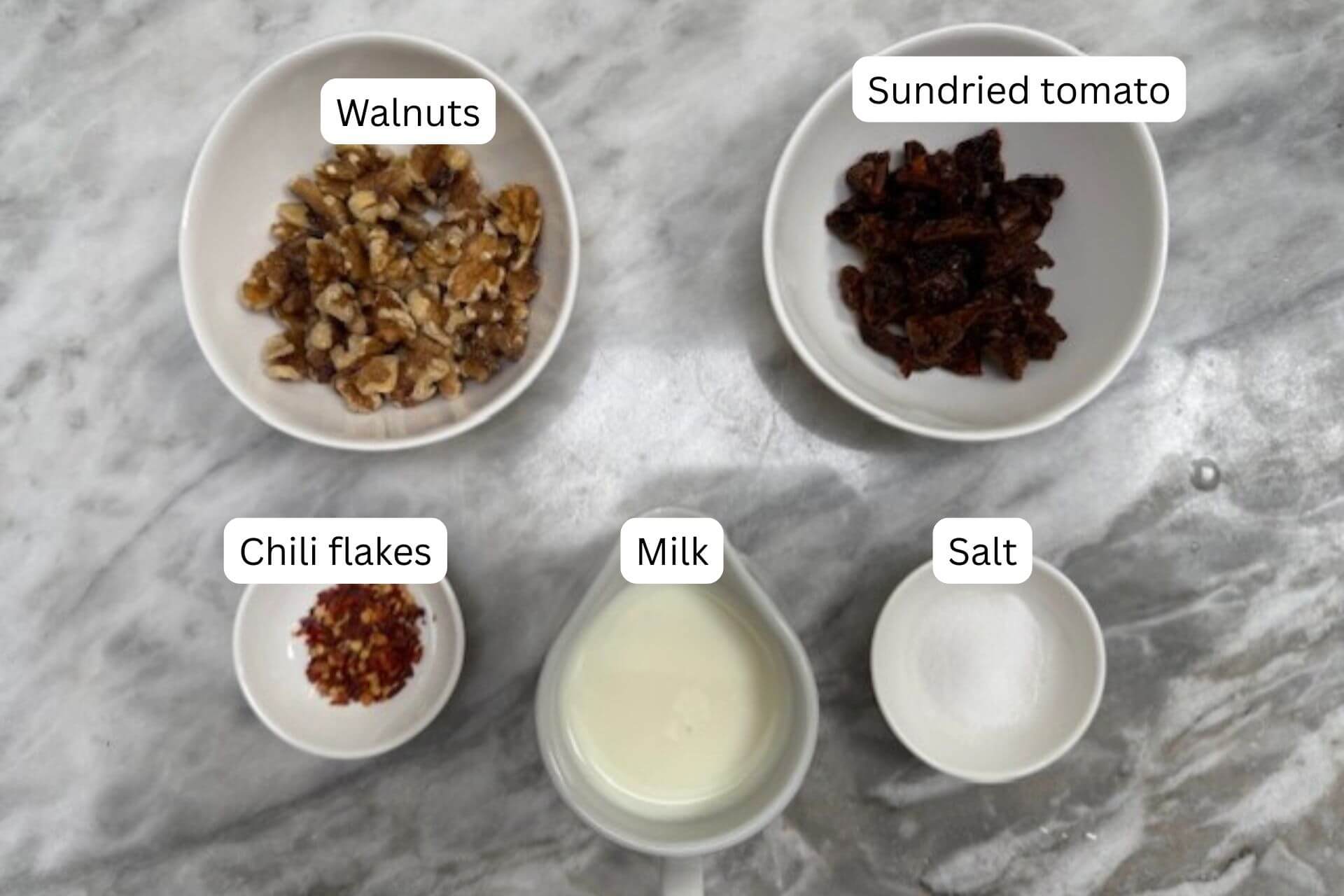 measured ingredients in bowls for the paste