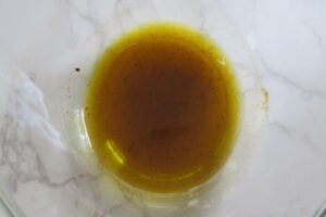 olive oil mixed with salt and pepper in a bowl