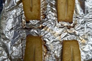 tofu pieces air fried in a foil lined tray