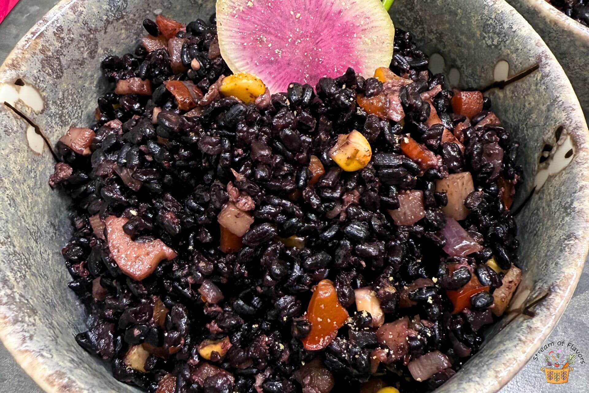 fried black rice in a bowl