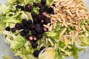 Brussels sprouts with poppy seed vinaigrette, blueberries and almonds