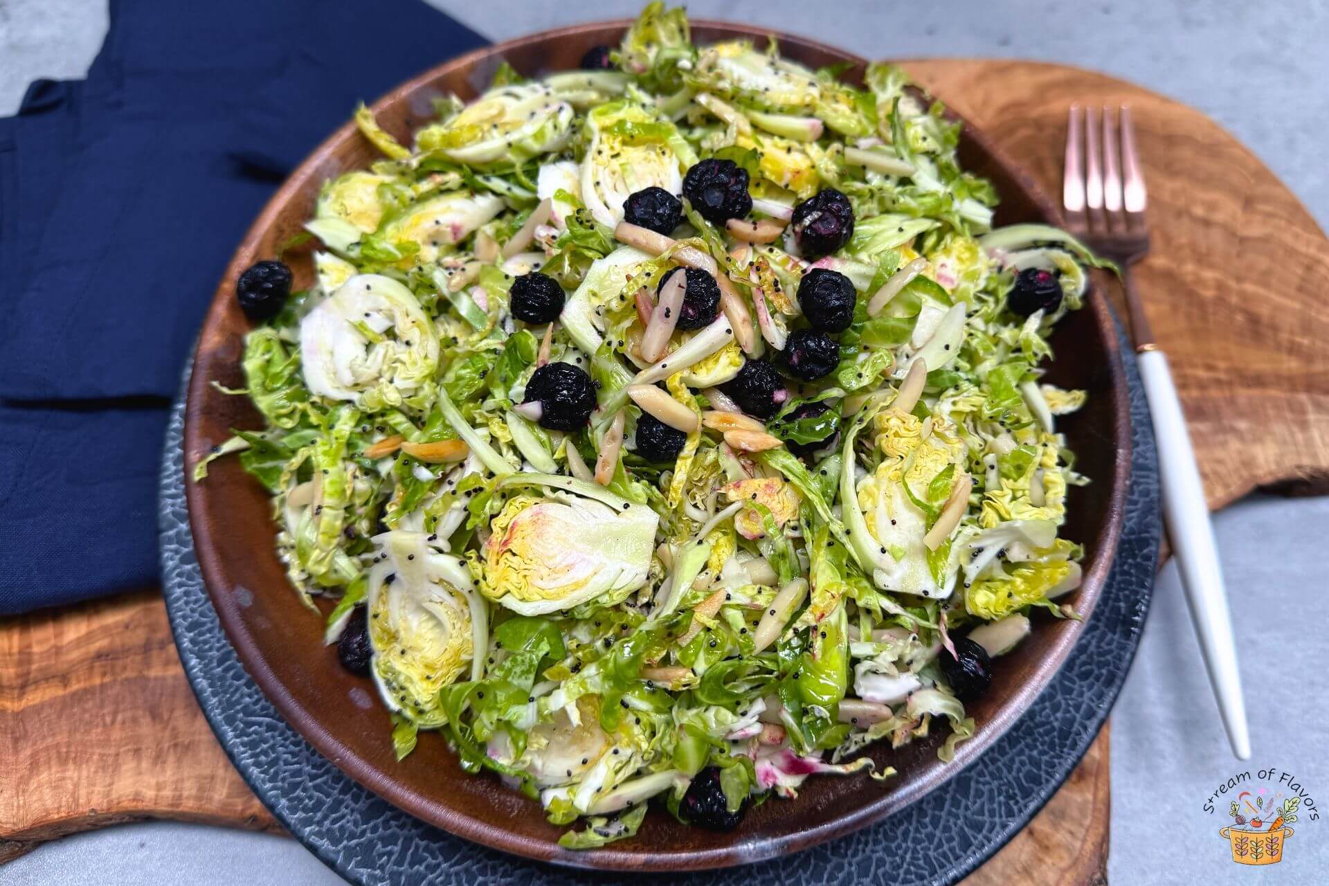 shaved brussels sprouts salad in a wooden bowl