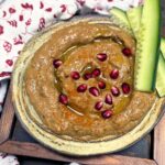 lebanese baba ganoush with pomegranate arils and cucumber slices on the side