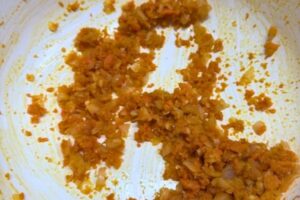 grated carrots added to the onion